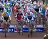 Screenshot from 2012 Roubaix Cyclocross World Cup, riding around barriers.
