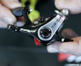 The TRP Brakes' post-recall dual piston Spyre now has two adjustable pads, and clearer adjustment instructions. No more confusing 5mm hex hole to hide the 3mm hex adjustment bolt. - Frost Bike 2014. © Cyclocross Magazine