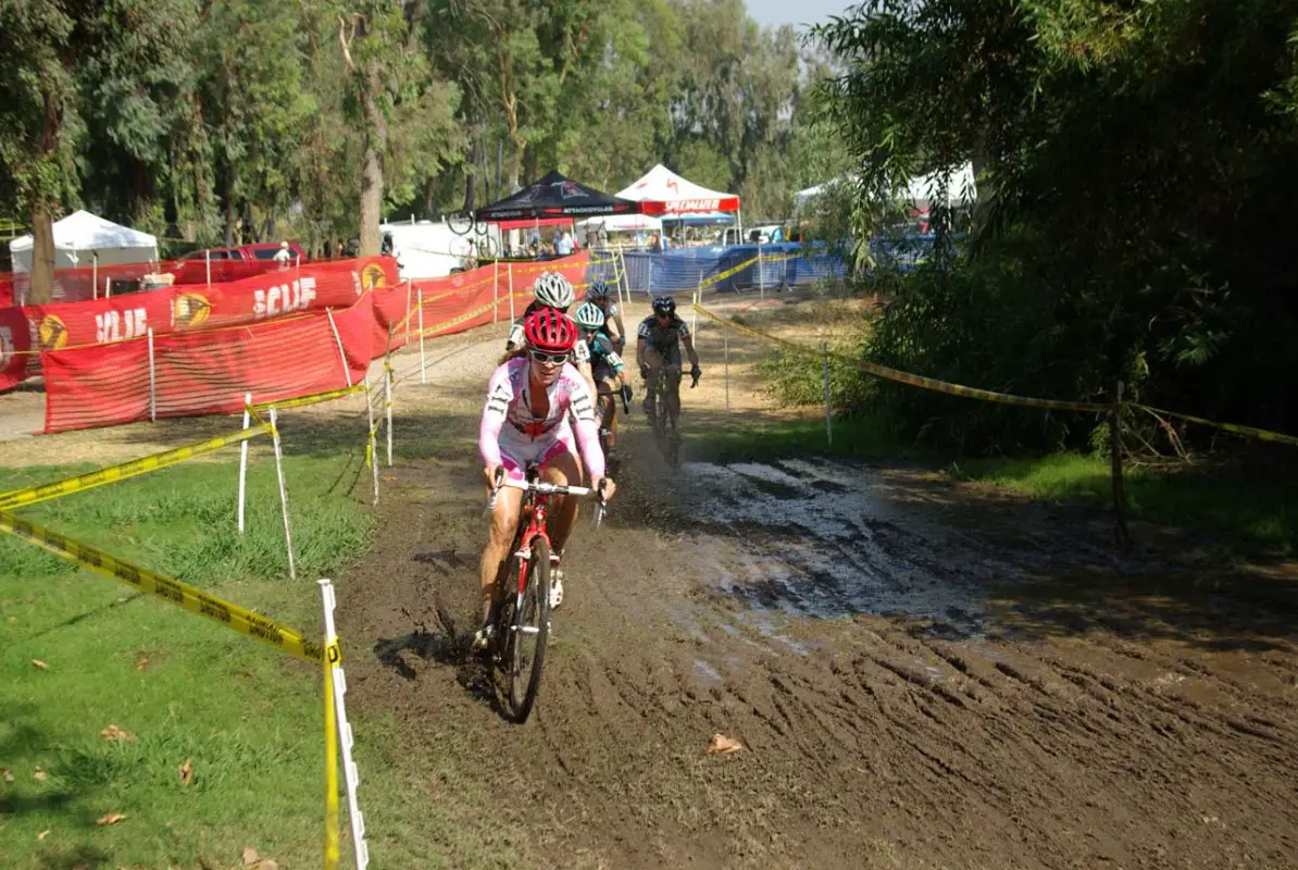 The lead women head through the mud. © Kenneth Kill, Light & Shadows