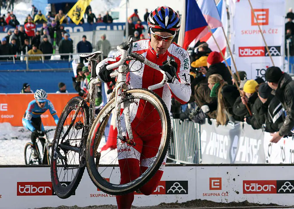 Poland\'s Pawel Szczepaniak ahead of Jim Aernouts early in the race. 2010 U23 Cyclocross World Championships. ? Bart Hazen