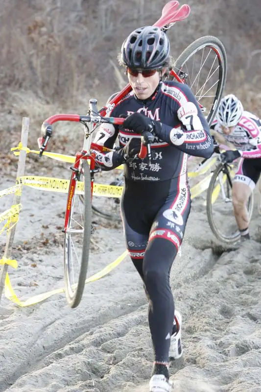 Josh Dillon puts a gap onto Derrick St. John. © Peter Ozolins Photography