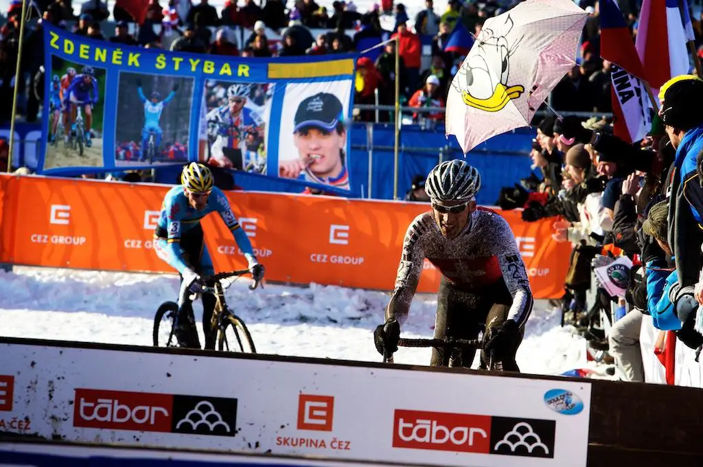 Switzerland's Christian Heule approaches the barriers just ahead of a hard-charging Klaas Vantornout at the 2010 Cyclocross World Championships in Tabor, Czech Republic.  ? Joe Sales