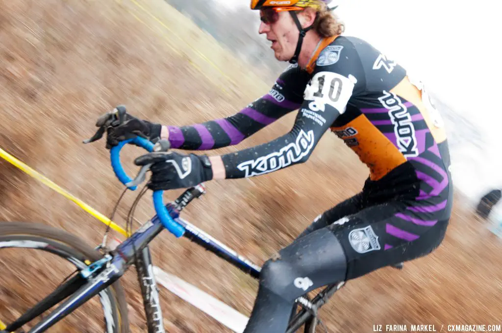 Barry Wicks (Kona) easily handles the muddy descent. ©Liz Farina Markel