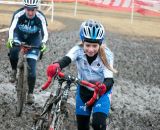 Tess Anderson (Spin Doctor Cyclewerks) charges through the mud. ©Liz Farina Markel