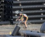 A rider pushes through a corridor of culverts on the course. ©Pat Malach