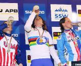 The women's podium celebrates with a drink of bubbly