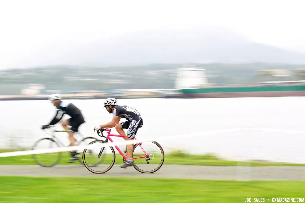 Two masters racers zoom along the waterfront pathway. © Joe Sales