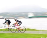 Two masters racers zoom along the waterfront pathway. © Joe Sales
