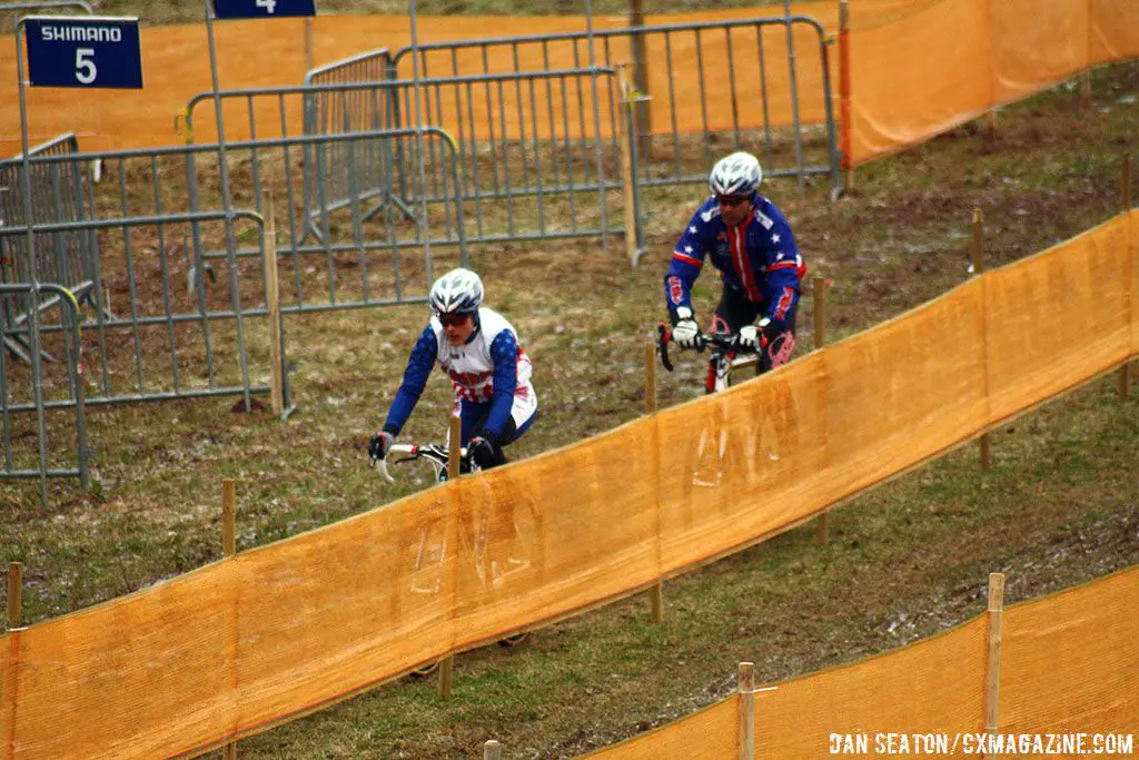 Katie Compton & husband Mark Legg ride through the pits