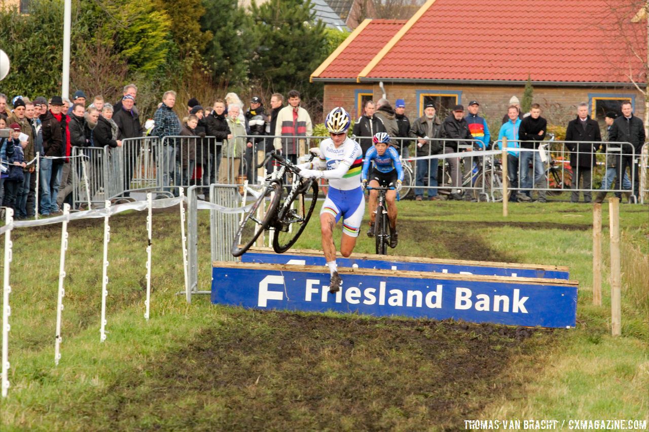 Vos jumping the barriers with Wyman behind © Thomas van Bracht