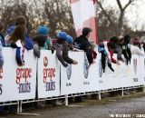 Fans banging the boards along the start/finish stretch gave the racers some added motivation. © Cyclocross Magazine