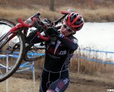 Emma White shoulders her bike up the run-up. © Cyclocross Magazine