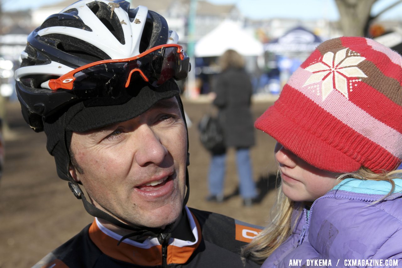 Brandon Dwight celebrates with a little one. 2012 Cyclocross National Championships, Masters Men 40-44. ©Amy Dykema