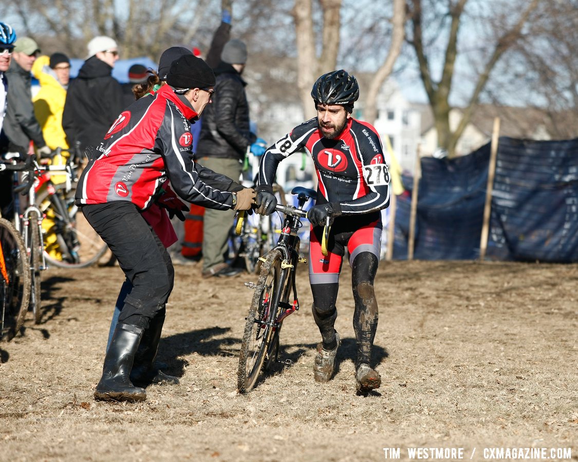 Maurice Gamanho (Van Dessel Factory Team) changes bikes in the pits