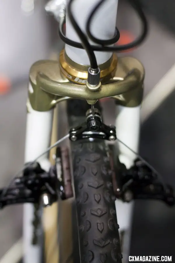 Peacock Groove\'s Erik Nored modified the fork crown to integrate a cable hanger. NAHBS 2012.  ©Cyclocross Magazine