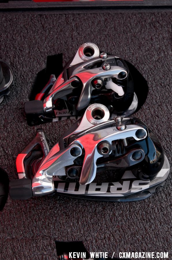 SRAM\'s new mid-cage Red rear derailleur, bottom, that is compatible with it\'s WiFLy expanded range 11-32 road cassette will hit the shelves in June. © Kevin White