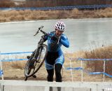 Lauri Webber takes the barriers, game face on. © Cyclocross Magazine