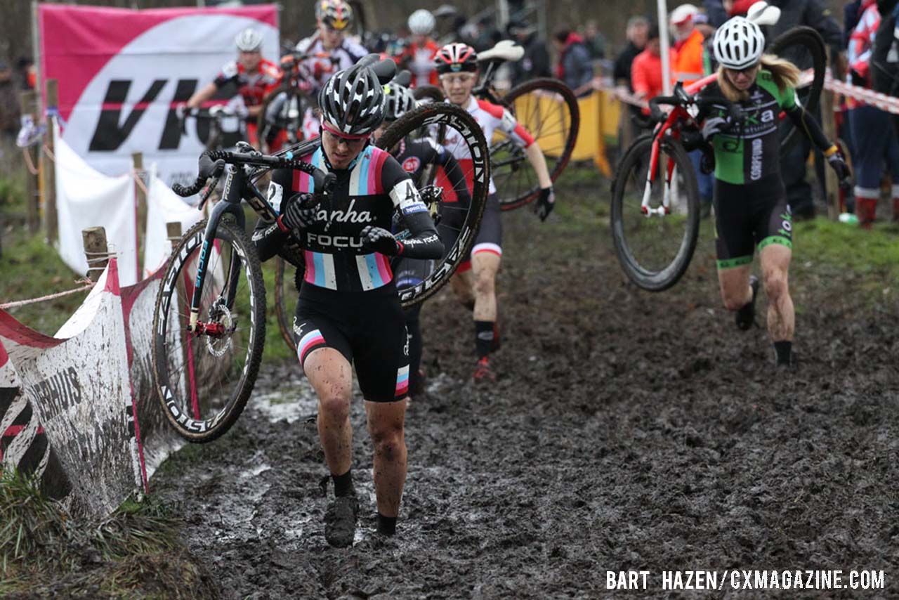 Gabriella Durrin (Rapha-Focus) running through the mud. © Bart Hazen / Cyclocross Magazine