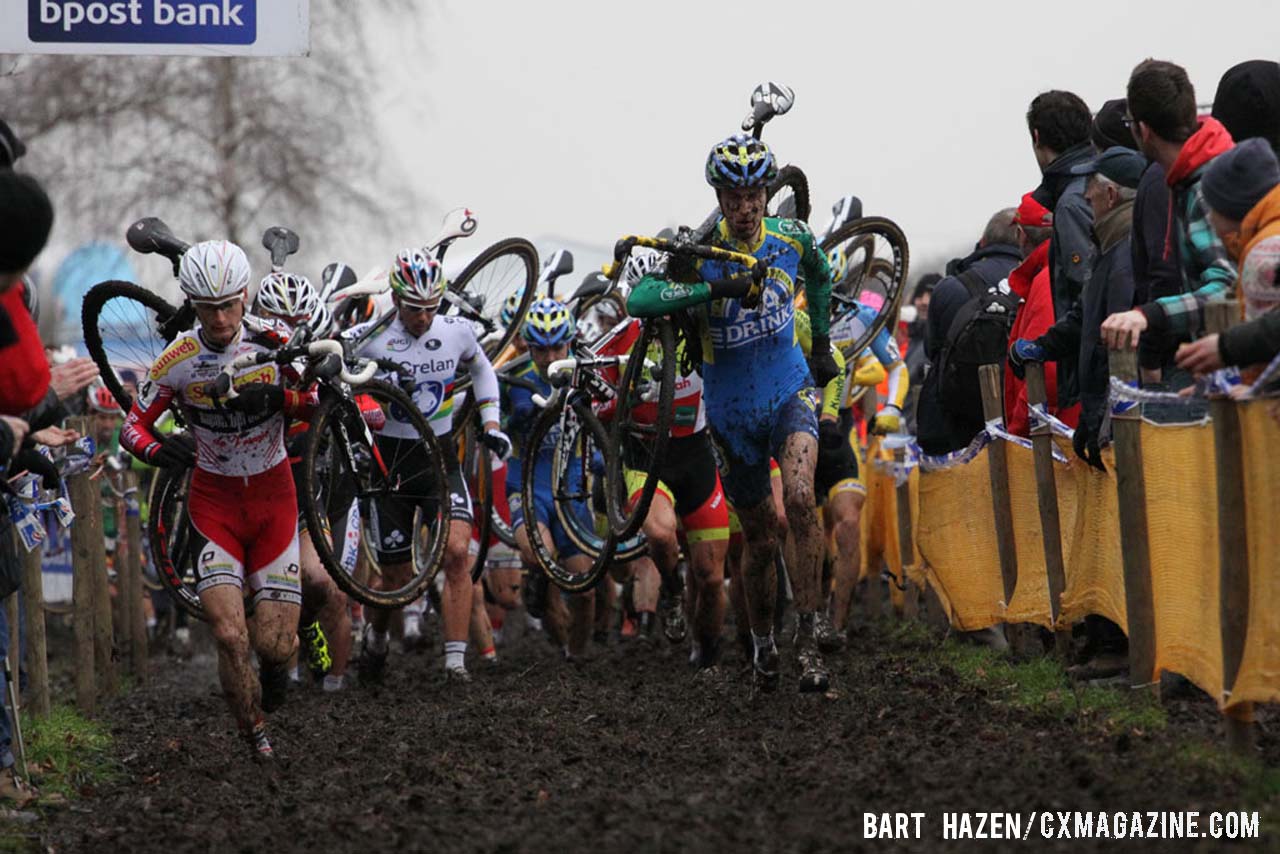 The Elite Men\'s field runs through the mud at Essen. © Bart Hazen / Cyclocross Magazine
