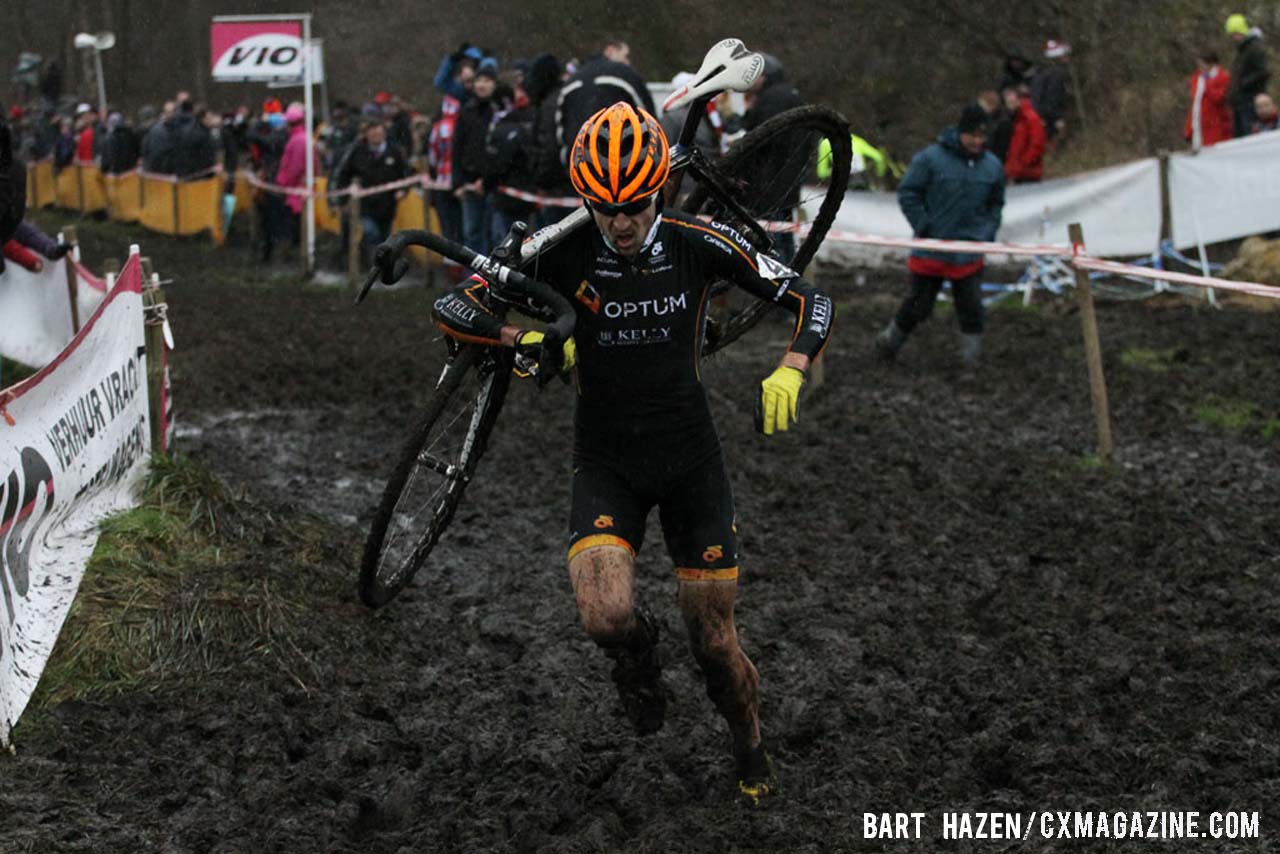 Jeremy Durrin (Optum p/b Kelly Benefit Strategies) runs through the mud. © Bart Hazen / Cyclocross Magazine