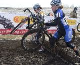 D2 Champ Erica Zaveta passing the D1 competition.  © Cyclocross Magazine