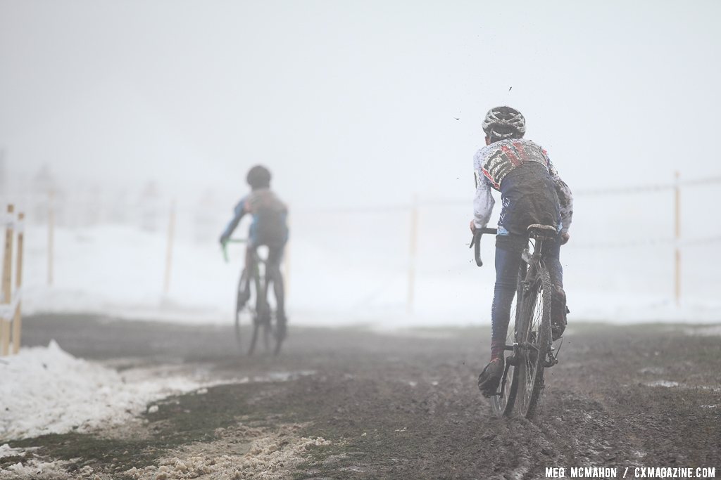 Philip Hempstead navigates the fog and mud to chase a 15th place.   © Meg McMahon