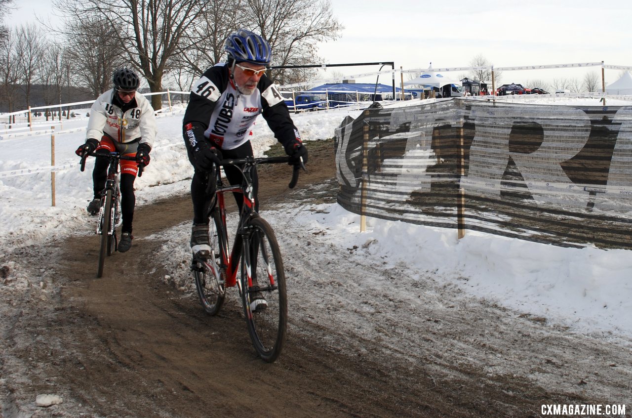 Walter Axthelm chased by Frederic Schmid for the 70+ title.  ©Cyclocross Magazine