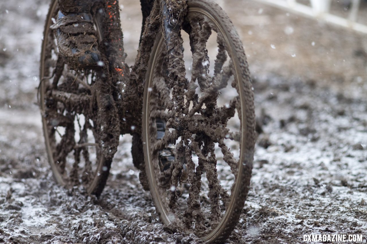 Thick mud covered everything, making normal spokes looks like carbon blads. © Cyclocross Magazine