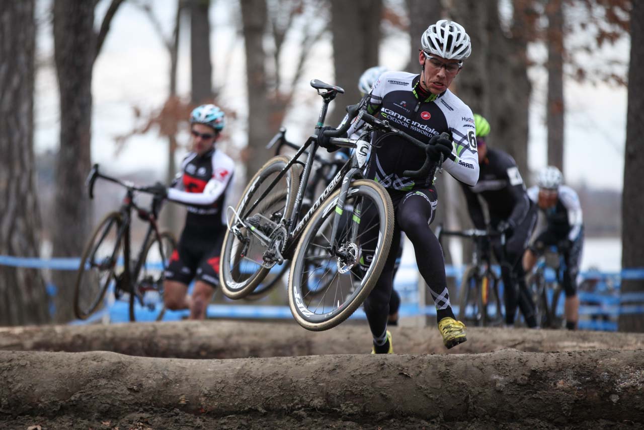 White leads the way through the log barriers. © Meg McMahon