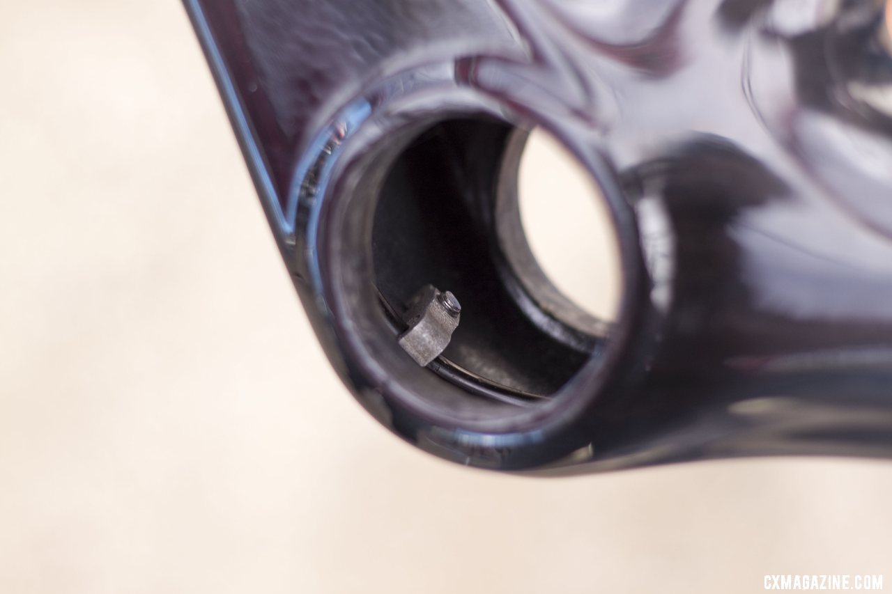 The internal cable housing clamp in the new Pressfit 30 bottom bracket shell of the 2013 Conquest Team carbon cyclocross frame. Sea Otter 2012. ©Cyclocross Magazine
