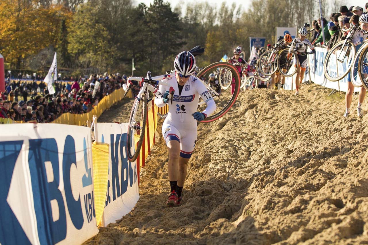 Katie Compton (Trek Cyclocross Collective) takes the low line to move up in position. © Thomas van Bracht