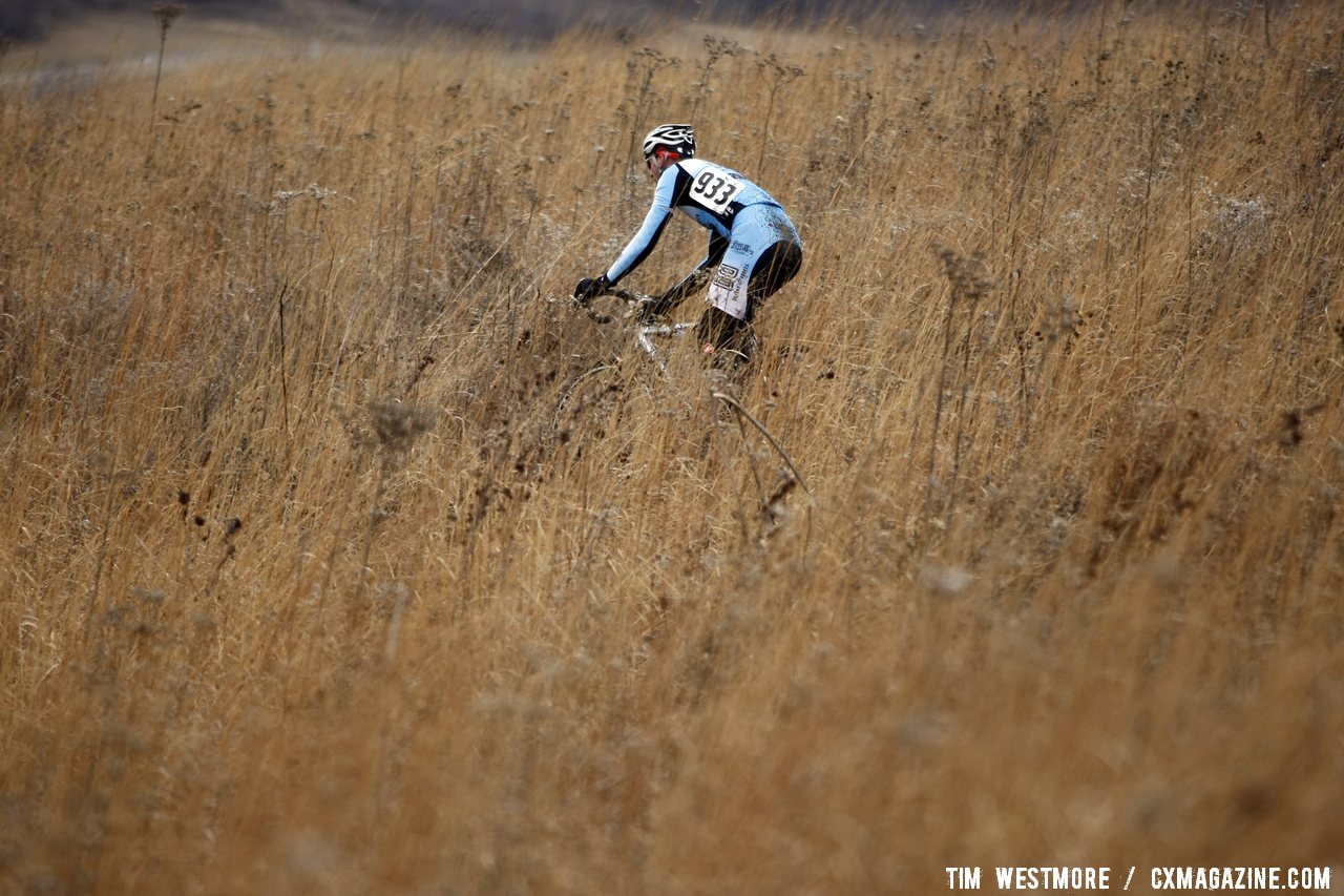 Tall grass makes for lonely stretches of riding. © Tim Westmore