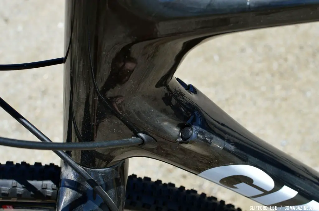 Internal cable routing. The plugged one is for the FD, to the left of that is the hydraulic line that eventually exits at the left rear chainstay going to the rear disc caliper on Adam Craig’s Prototype Giant TCX Advanced - Sea Otter 2013. © Clifford Lee