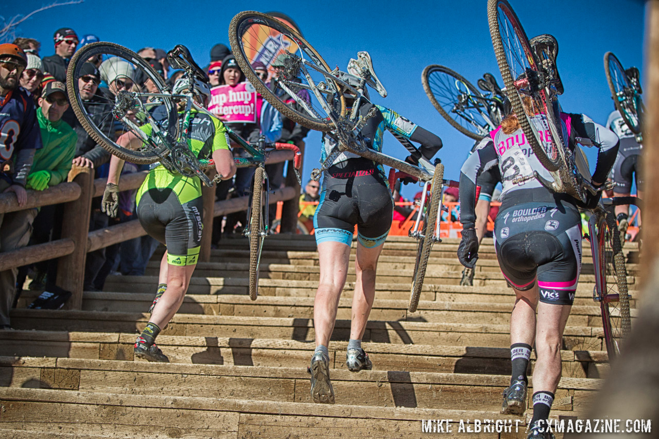 Elite women run the stairs at the 2014 USAC Cyclocross National Championships.