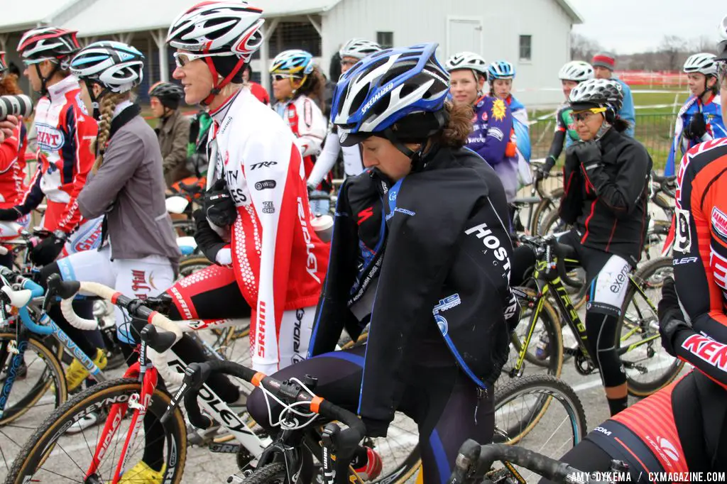 The elite women at Day 3 of Jingle Cross were shivering on the start line, trying to stay warm.  It was a windy, damp. cold day.  © Amy Dykema