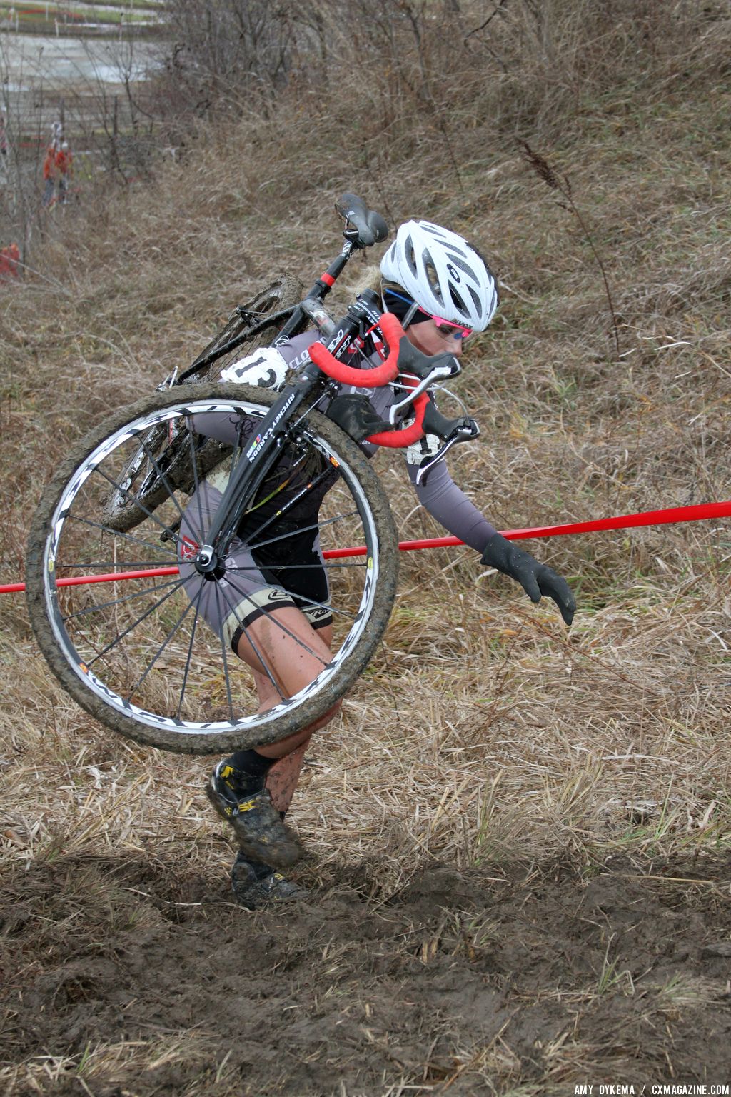 Amanda Carey chooses the less muddy line up the hill.