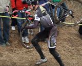 The spectators gathered on the steep and sometimes slippery side of the hill to watch and heckle the racers as they suffered on Mt. Krumpet. The racer here is Brian Matter (Gear Grinder). © Amy Dykema