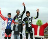 Day 3 podium:  Todd Wells (Specialized),  Tim Johnson (Cyclocrossworld.com/Cannondale), Jamie Driscoll (Cyclocrossworld.com/Cannondale), joined bt race director John Meehan, aka the Grinch. © Amy Dykema