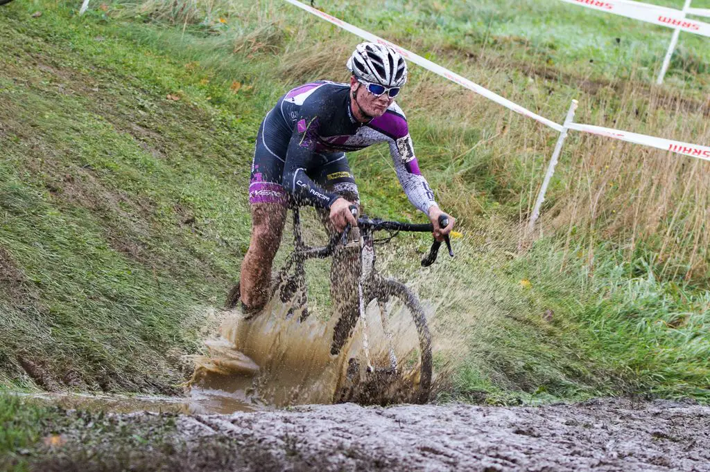 Peter Goguen hits the mud with a splash. © Todd Prekaski