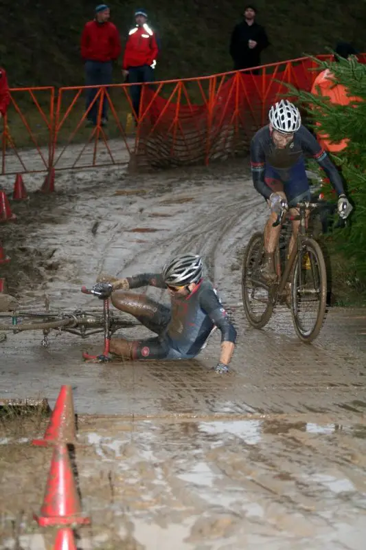 CXM's Josh Liberles (Corsa Concepts) bites the dust, or mud, while transitioning from slick corner to wooden bridge © Dave Roth