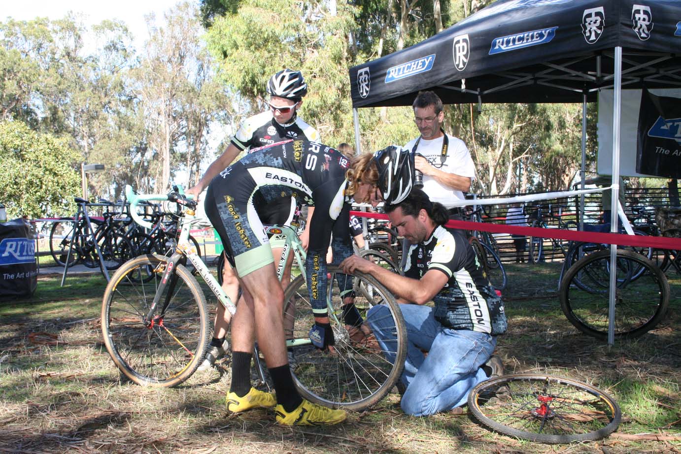 Scott Chapin hit the pits for a wheel change after flatting far away and losing the lead group. ?Cyclocross Magazine