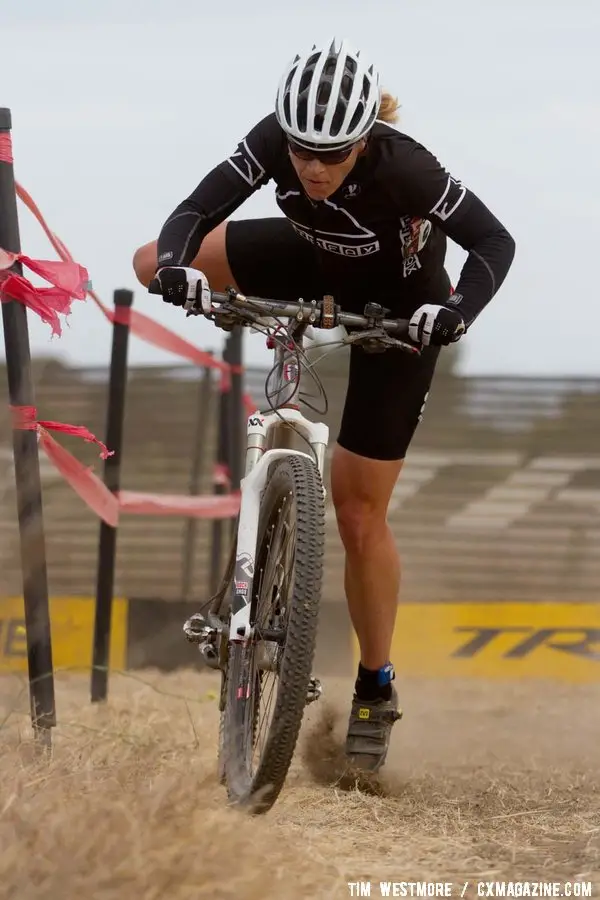 Helene Drumm remounts her mountain bike on the way to victory. © Tim Westmore