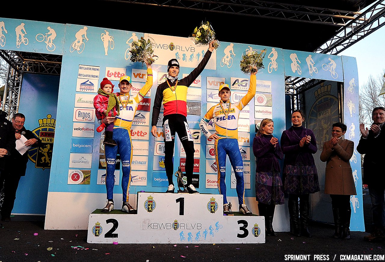 Bart Wellens (2nd) with his kid, Niels Albert Winner and Kevin Pauwels (3rd) on the podium of the 2011 Belgian Championship cyclo cross race in Antwerpen. Sunday Jan. 9, 2010. ( SPRIMONT PRESS / Laurent Dubrule )
