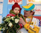 Bart Wellens holding his child on the podium as he finished 2nd the 2011 Belgian Championship cyclo cross race in Antwerpen. Sunday Jan. 9, 2010. ( SPRIMONT PRESS / Laurent Dubrule )