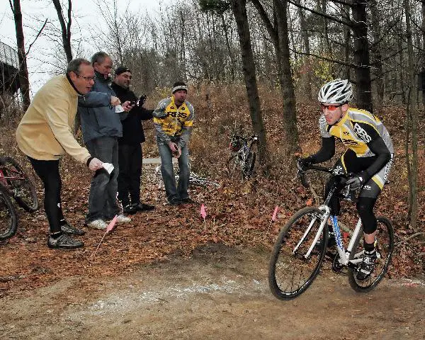 Cowbells ring as Rochester Bike Shop rider Adam Naish races through the woods ? Andrea Tucker 2009