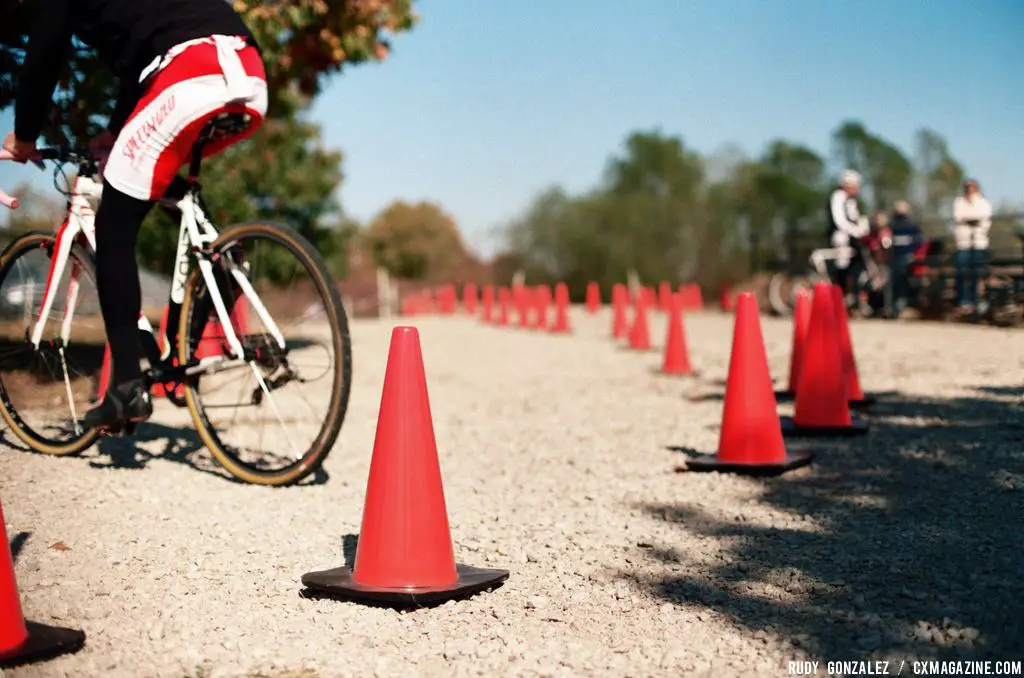 On the second to last lap of the open race, John Williams, who placed eighth in Cat 3, enters the gravel section near the BMX ramps around a tricky corner. © Rudy Gonzalez