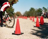 On the second to last lap of the open race, John Williams, who placed eighth in Cat 3, enters the gravel section near the BMX ramps around a tricky corner. © Rudy Gonzalez