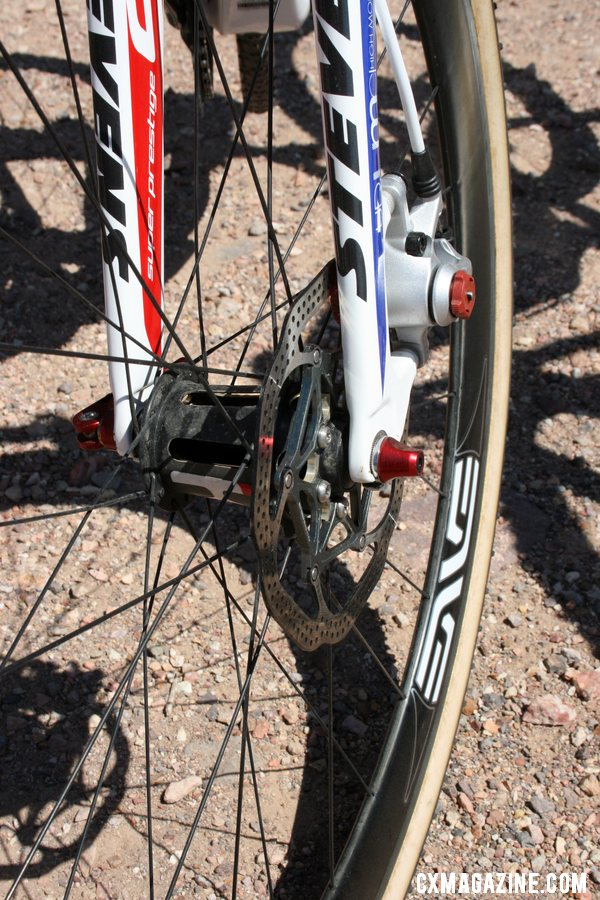 Brady shows off the Kappius front hub: hollow slotted carbon body means very light weight, but how will it shed mud this season? © Cyclocross Magazine