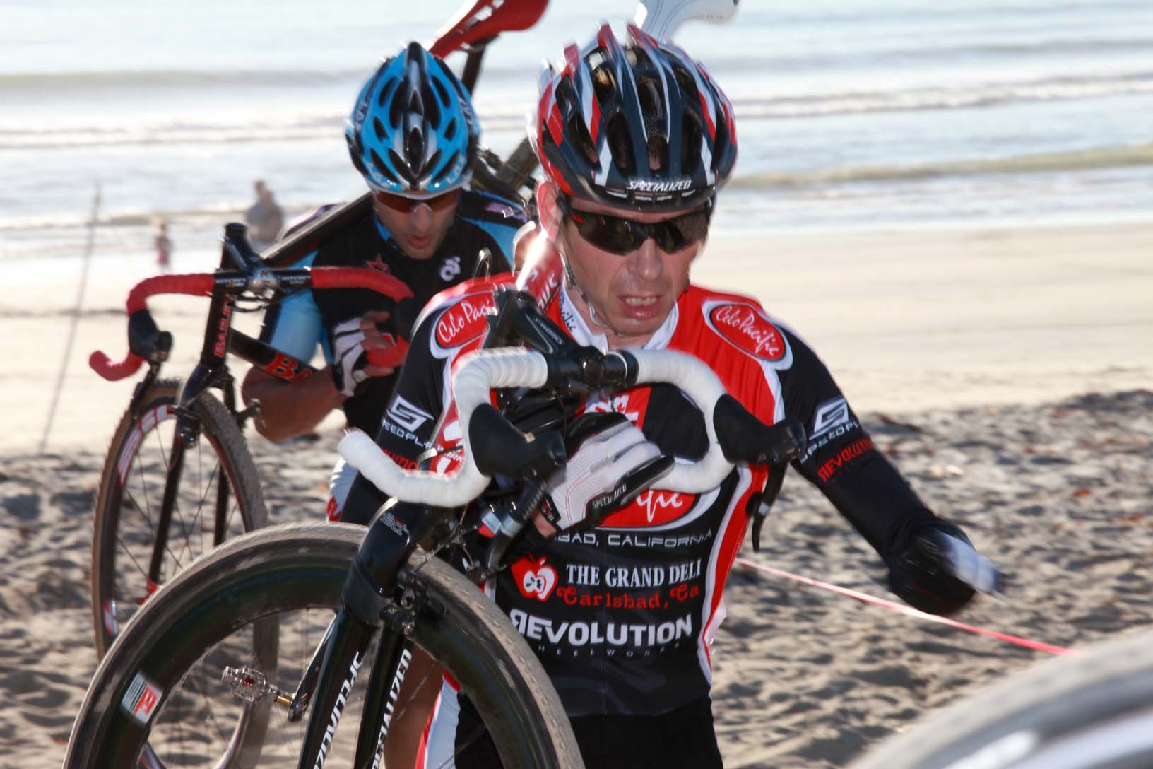 Brent Prenzlow leads John Bailey up the beach at Storm the Beach CX. ? Richard Murphy