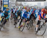The 17-18 riders charge onto the course at the Elite World Championships of Cyclocross 2013. © Brian Nelson